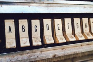close up photography of brown jukebox letter keys
