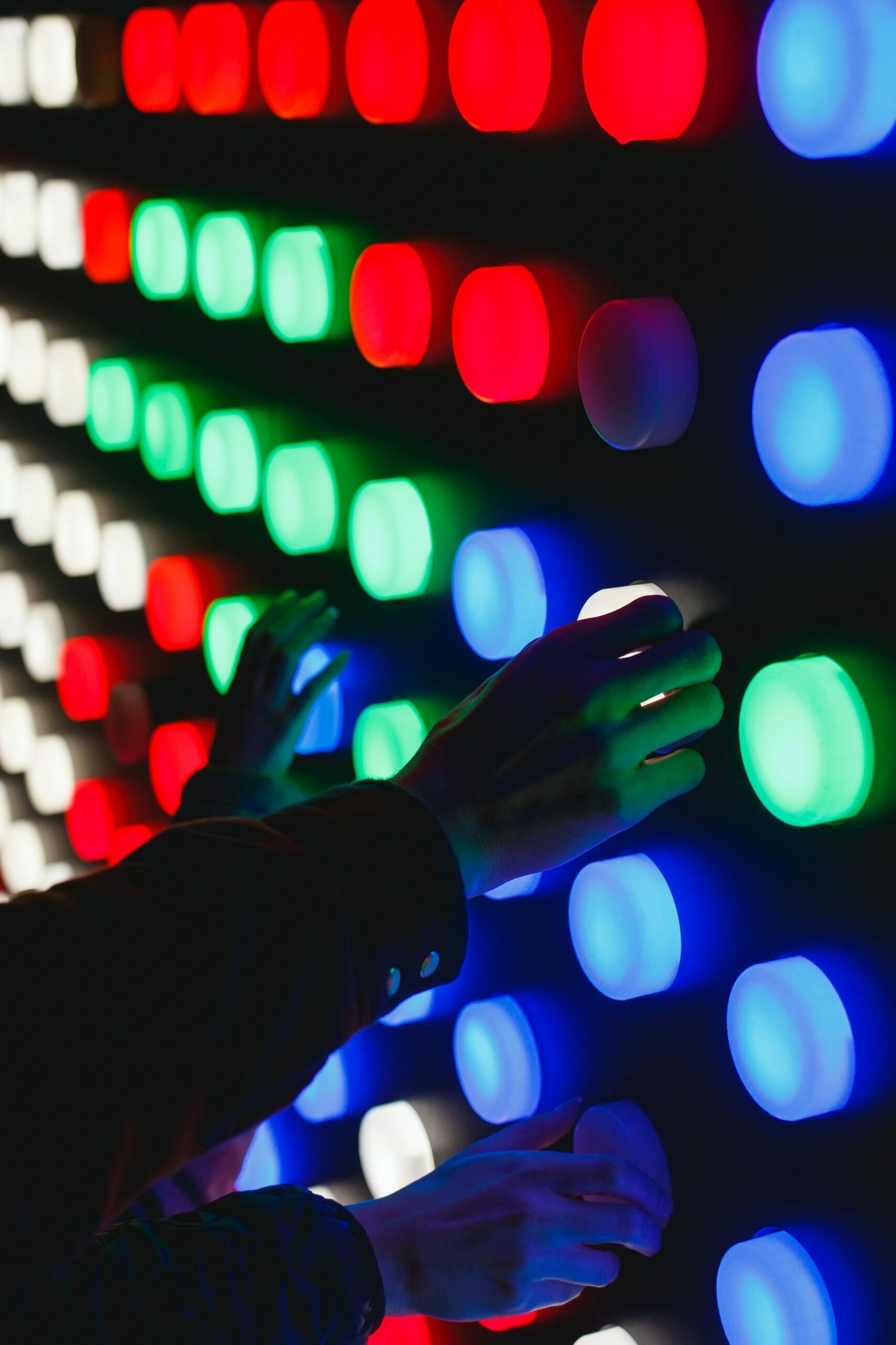 people holding assorted-color LED lights